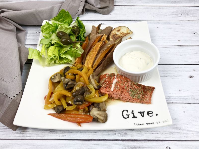 Salmon with sauteed pepper and mushrooms and baked potato wedges